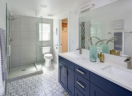 Master bathroom with glass door shower and custom flooring