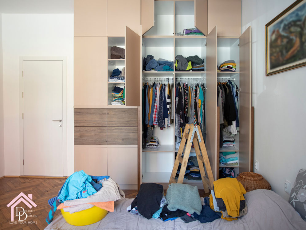a bedroom with a bed and a closet.