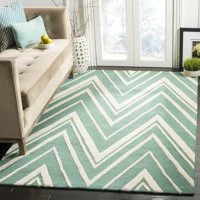 a living room with a couch and a rug.