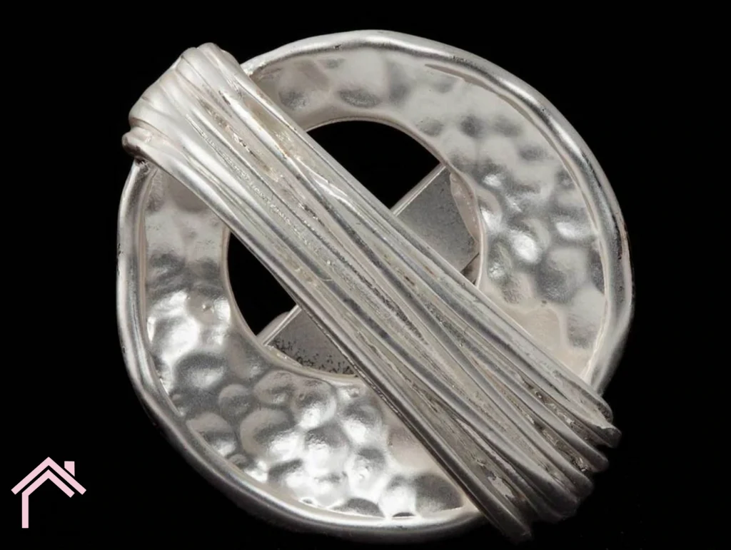 a metal object with a black background.