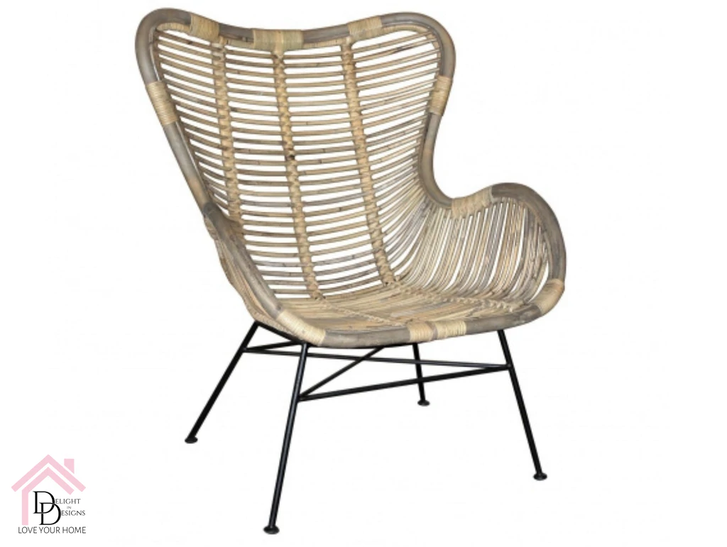 a wicker chair with black legs and a white background.