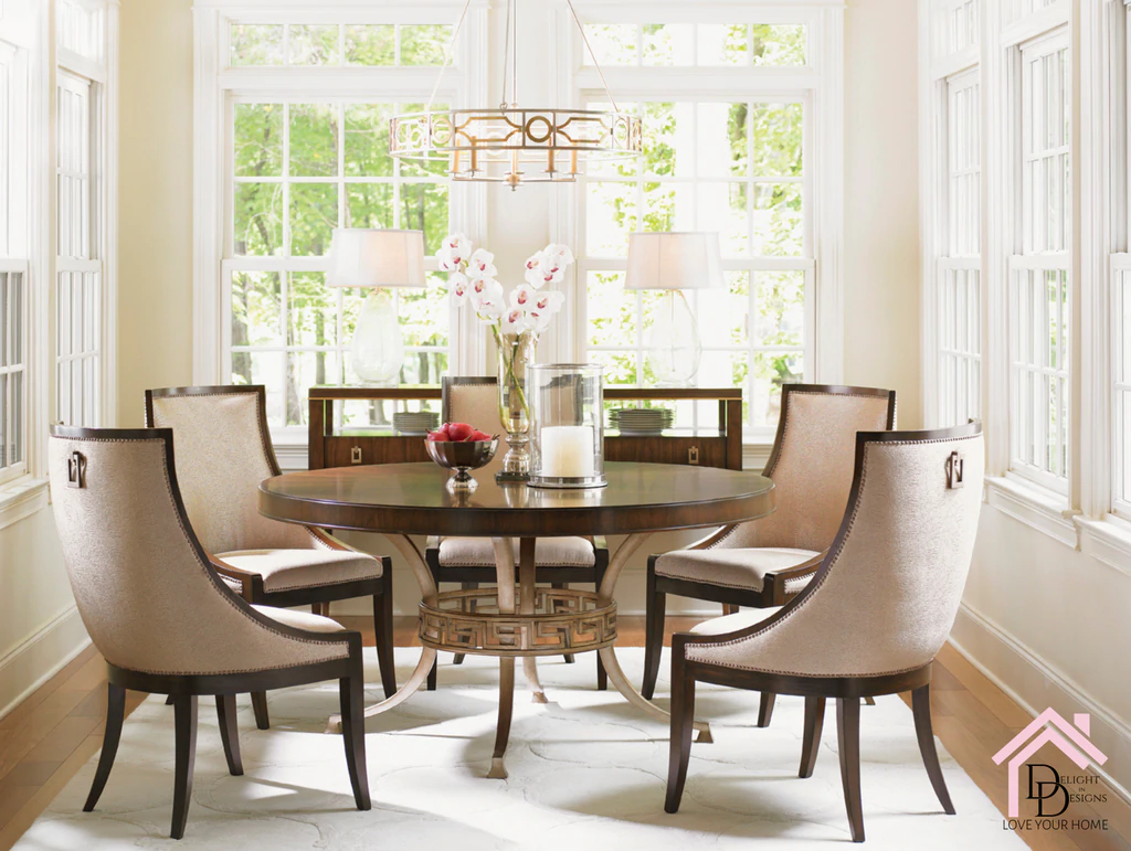 a dinning room table with chairs and a vase of flowers.
