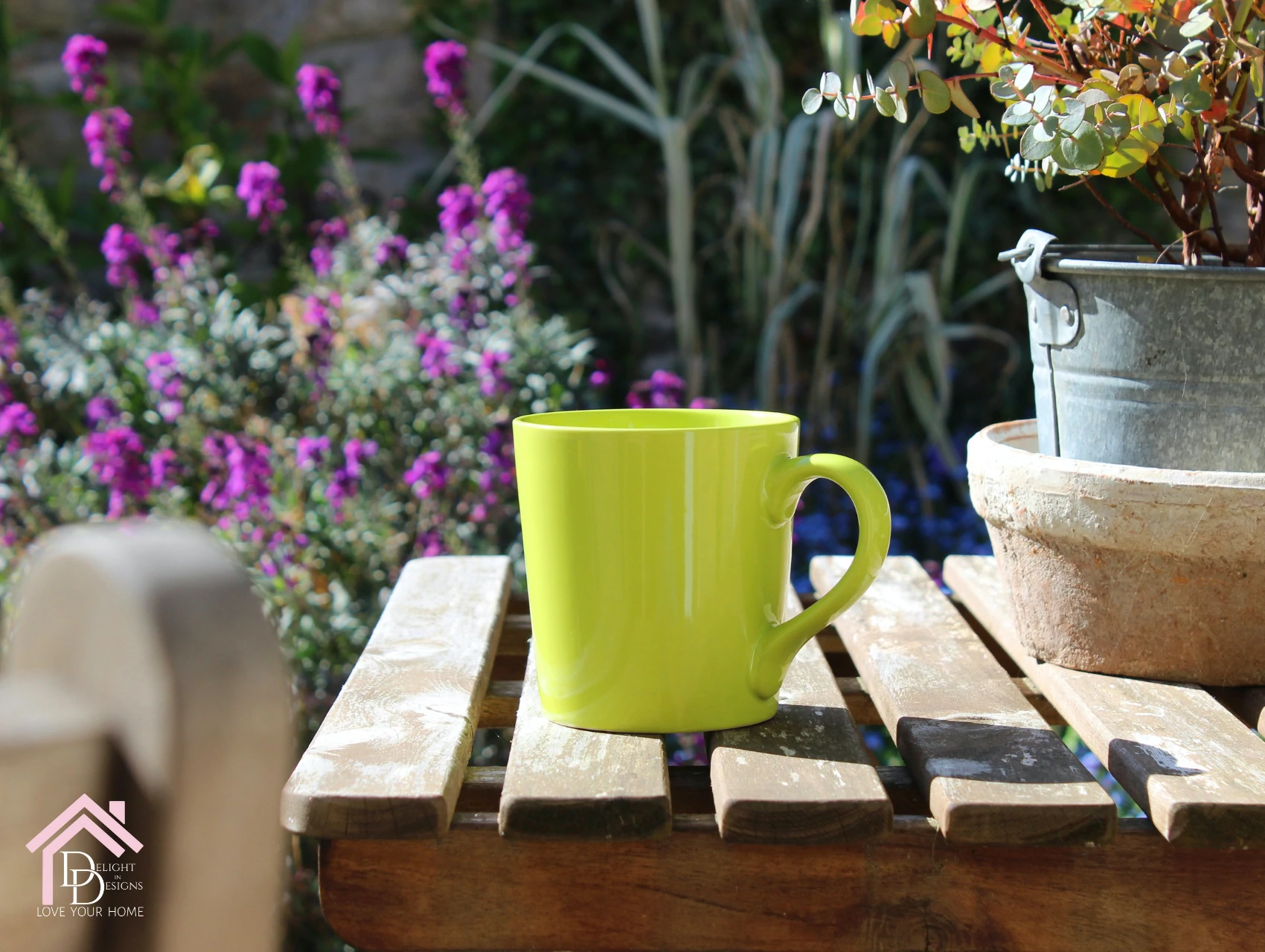 a yellow coffee cup sitting on a wooden table.