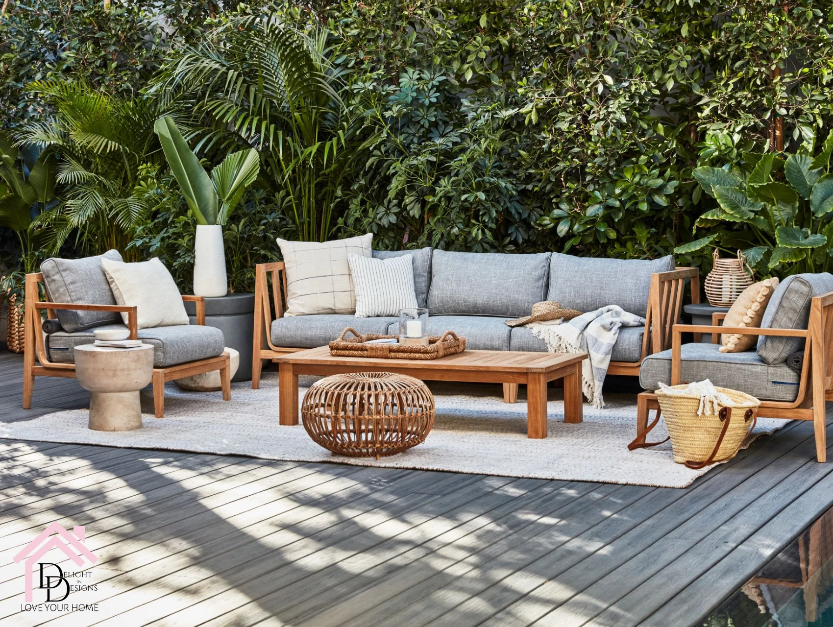 a living room with a lot of furniture on a deck.
