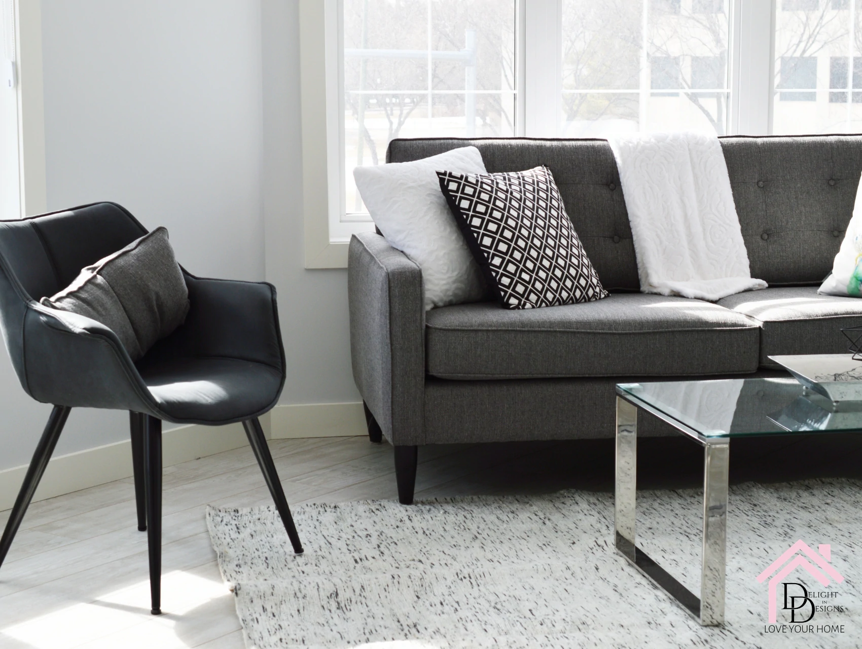 a living room filled with furniture and a window.
