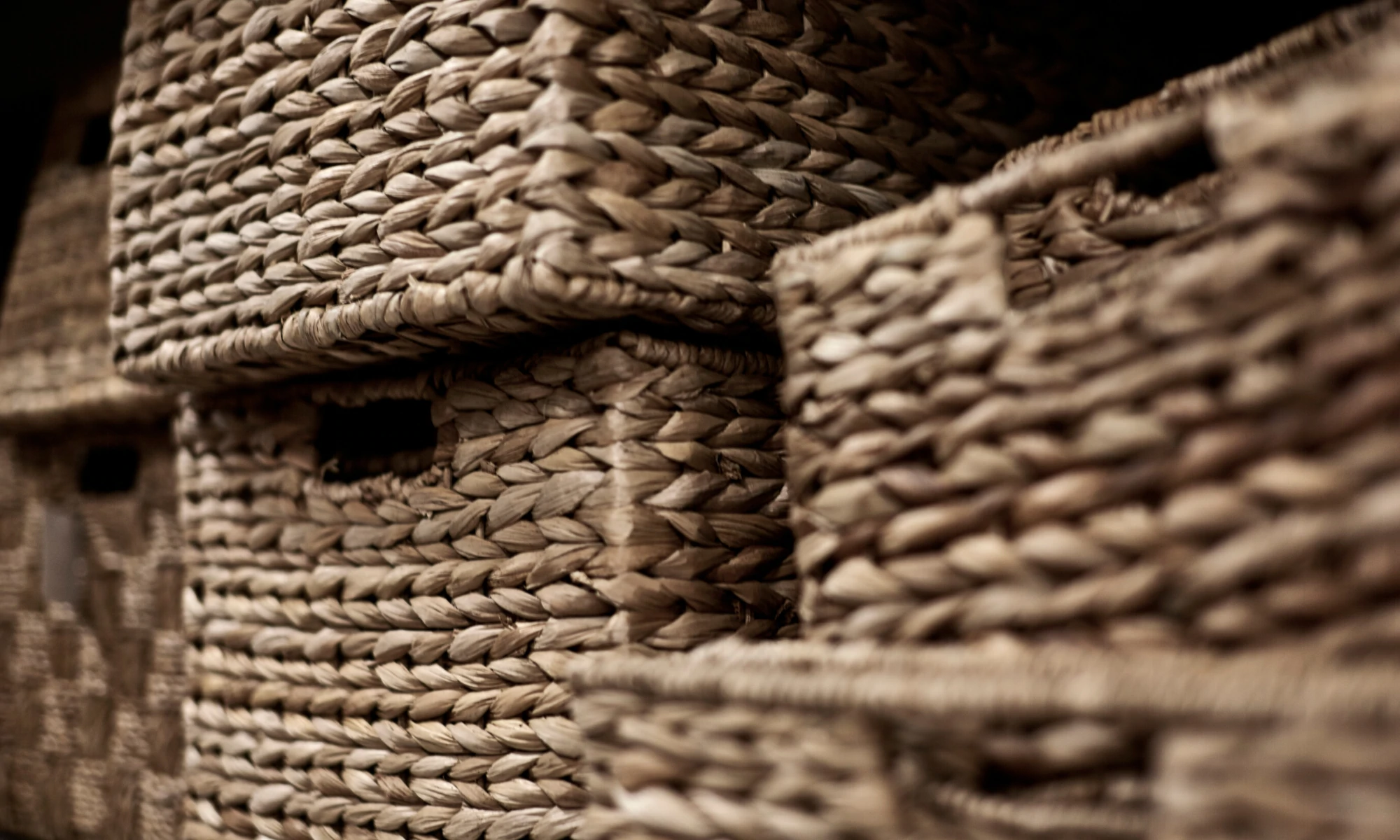 a bunch of baskets stacked on top of each other.