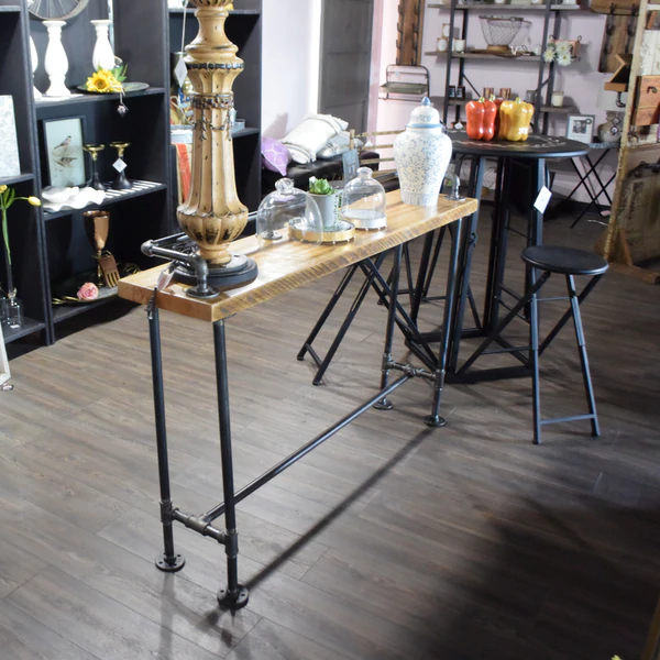 a room filled with furniture and a wooden table.