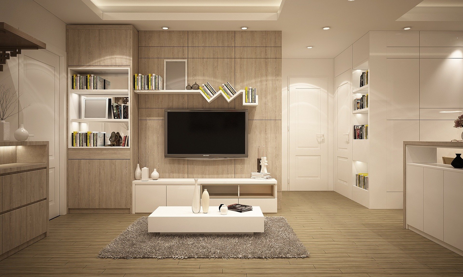 a modern living room with a large tv on the wall.