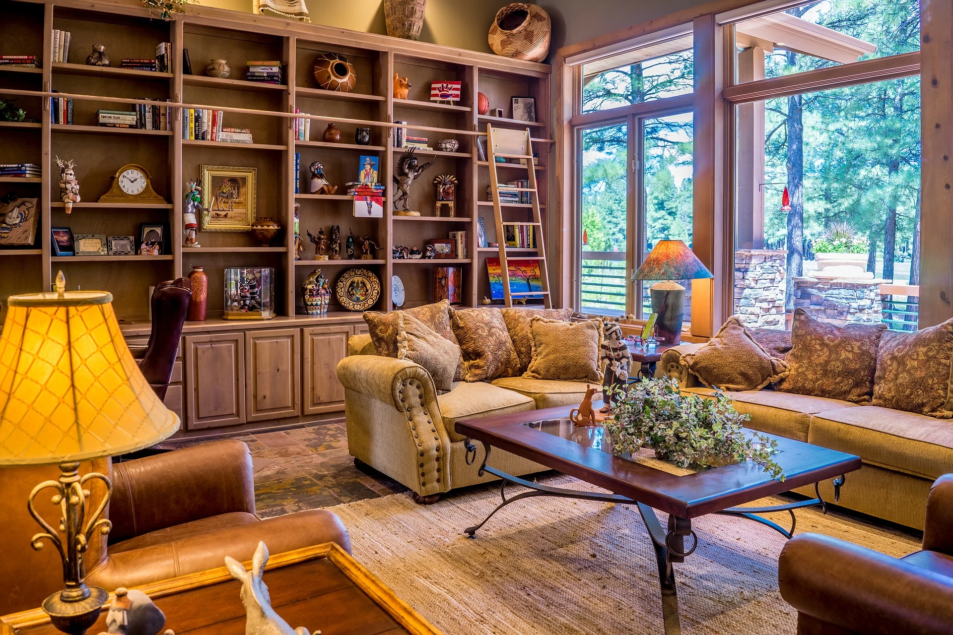 a living room filled with furniture and a large window.