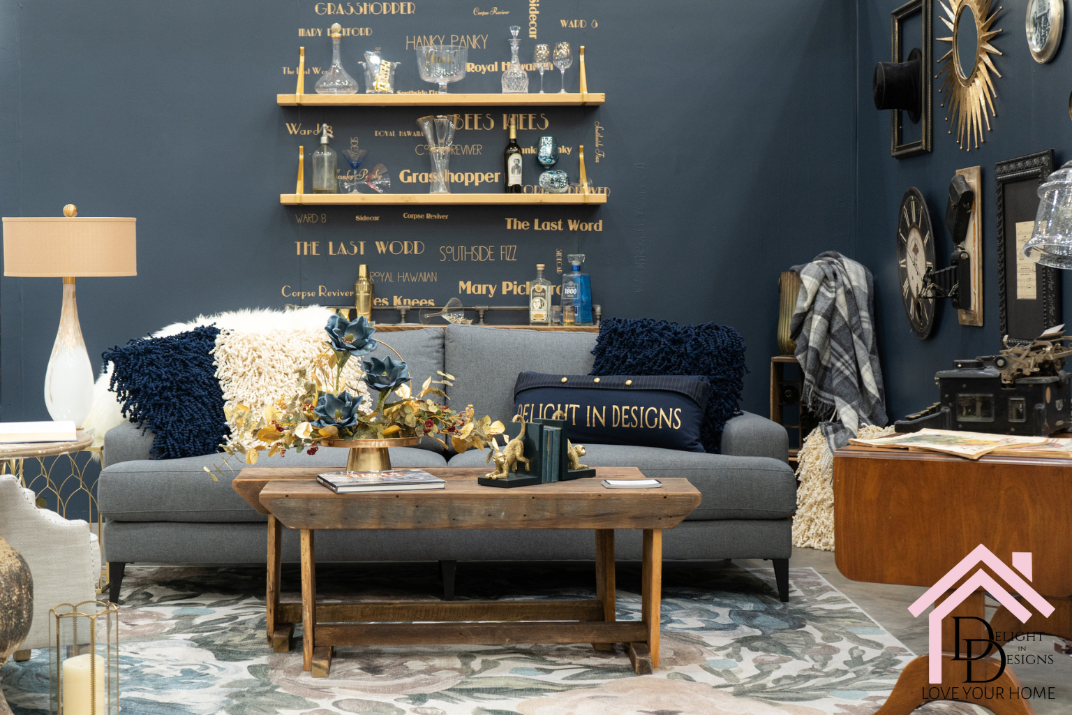 Blue living room, blue couch with a 20s themed bar in the back interior design