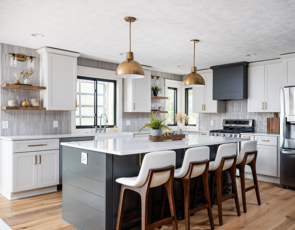 White and Grey Kitchen with large island, 4 bar white bar chairs with gold light fixtures over it. New Year Resolutions
